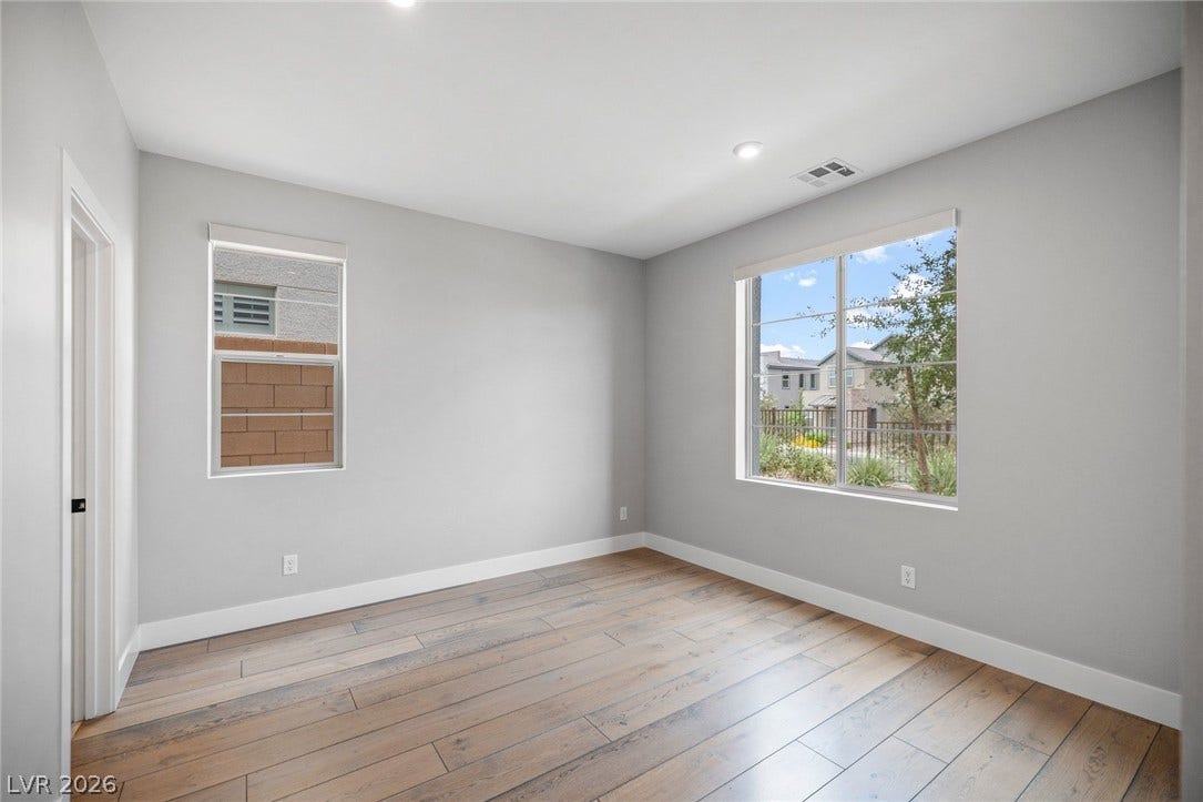 3194 Poplar Crest Court, Henderson, NV 89044 Hardwood floors and natural light illuminate this airy room, perfect for versatile living.