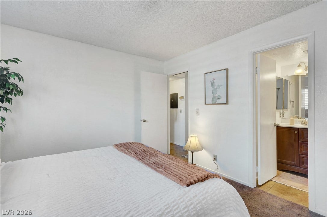 Well-lit sleeping quarters with convenient ensuite bathroom access.