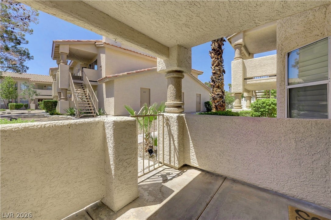 Secure gated entry to this inviting patio space, offering tranquil outdoor living.