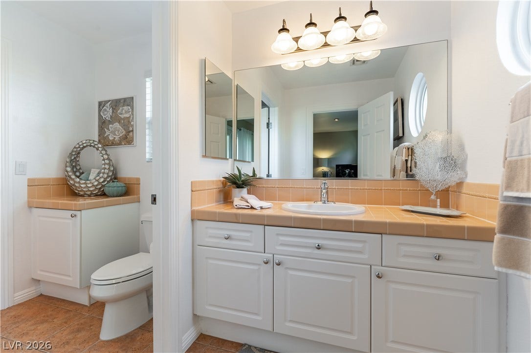 2676 Botticelli Drive, Henderson, NV 89052 A well-appointed off the other bedroom with large vanity with ample counter space and cabinet storage.
