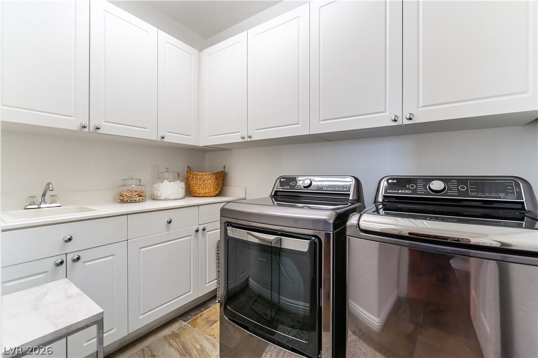 2676 Botticelli Drive, Henderson, NV 89052 Nice laundry room comes with upgraged washer and dryer, convenient utility sink and lots of cabinets for storage.