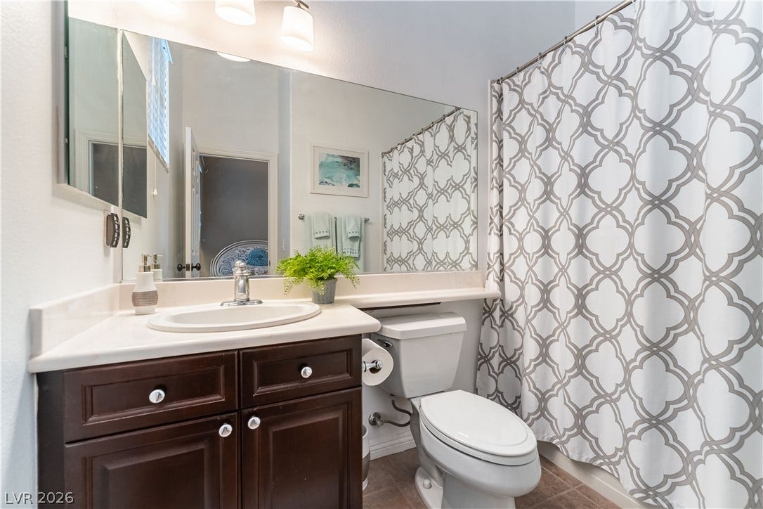 2676 Botticelli Drive, Henderson, NV 89052 A well-appointed bathroom attached to the downstair bedroom tub and shower.