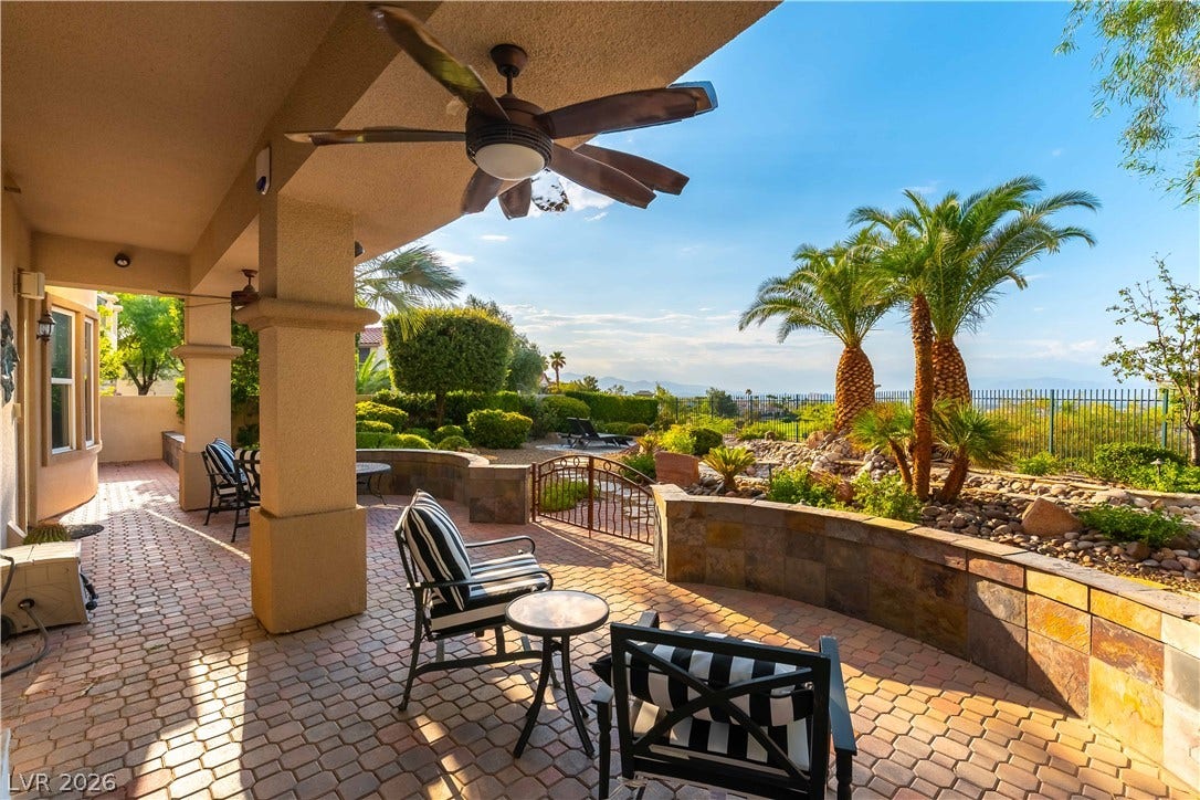 2676 Botticelli Drive, Henderson, NV 89052 Large paver stone patio extends into a meticulously landscaped yard with a panoramic view of strip, golf course and distant mountains.