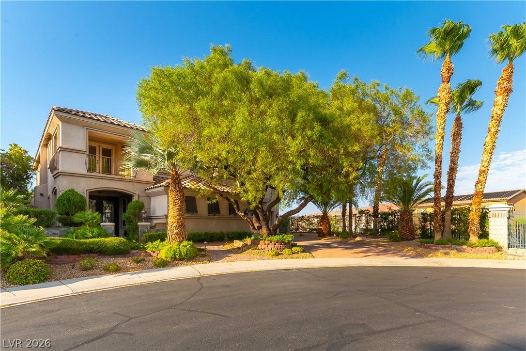 2676 Botticelli Drive, Henderson, NV 89052 This elegant residence offers exceptional curb appeal with paver stone driveways, sidewalk and mature trees and lush landscaping on the end of a cul-de-sac!