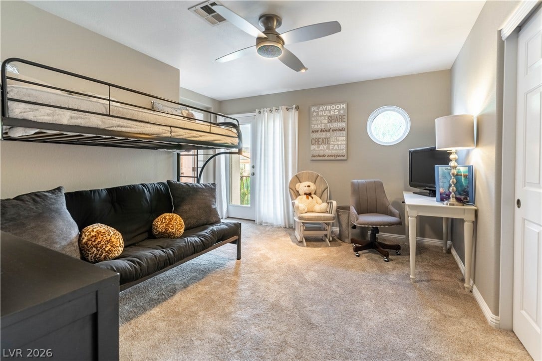 2676 Botticelli Drive, Henderson, NV 89052 A versatile bedroom offers comfortable sleeping set-up, ceiling fan and light, patio door to balcony a space for a study area and bathroom access.