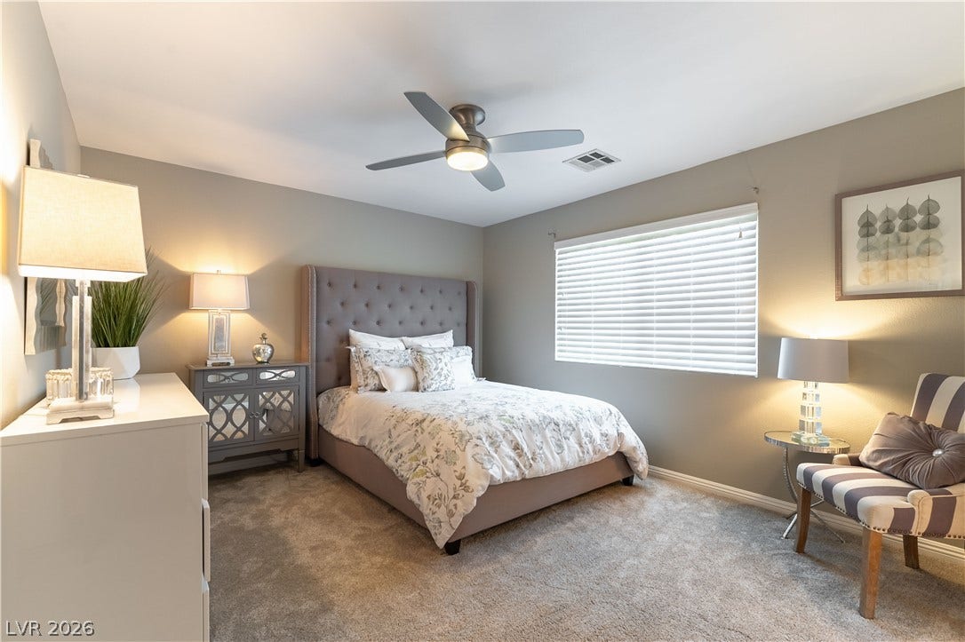 2676 Botticelli Drive, Henderson, NV 89052 A well-lit good size upstairs bedroom provides a restful retreat, ceiling fan and light and ample natural light.