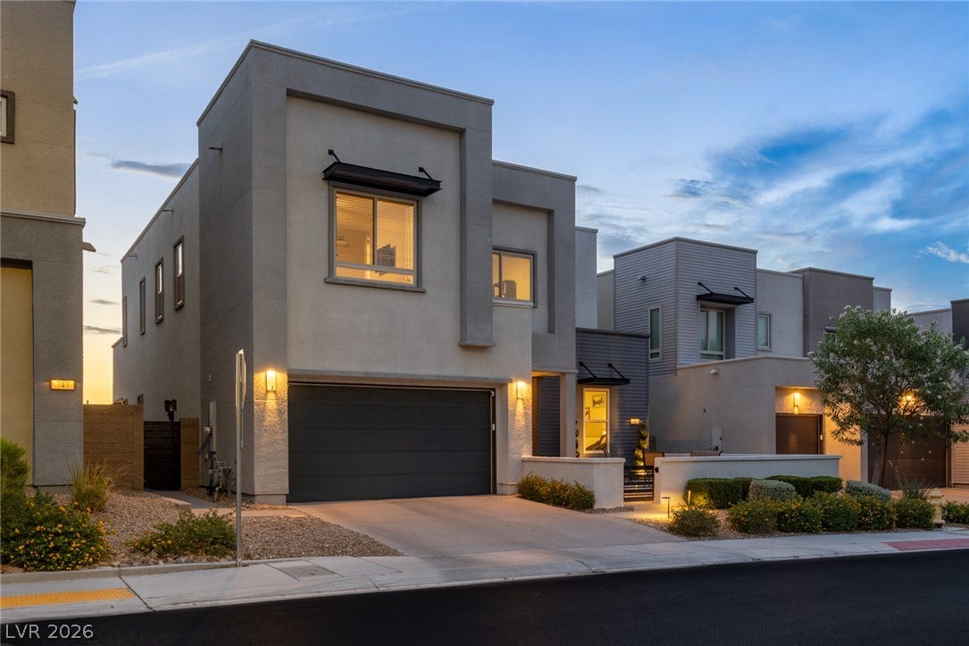 743 Glowing Horizon Street, Henderson, NV 89052 Clean lines and modern design define this striking contemporary exterior featuring an integrated garage.