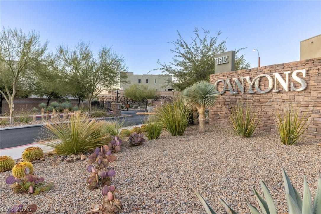 743 Glowing Horizon Street, Henderson, NV 89052 A well-maintained community entrance with desert landscaping welcomes residents home.
