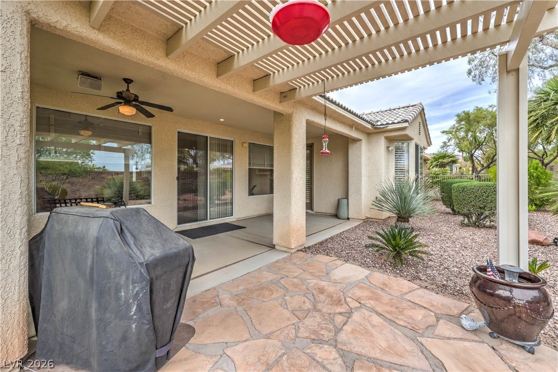 10298 Profeta Court, Las Vegas, NV 89135 An inviting covered patio offers ample space for entertaining and enjoying the meticulously landscaped private yard.