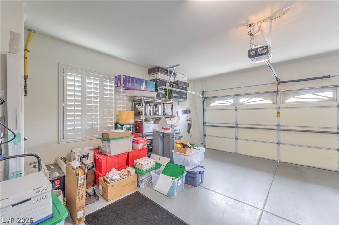 10298 Profeta Court, Las Vegas, NV 89135 A well-lit garage provides ample storage space and convenient access with an automatic door.
