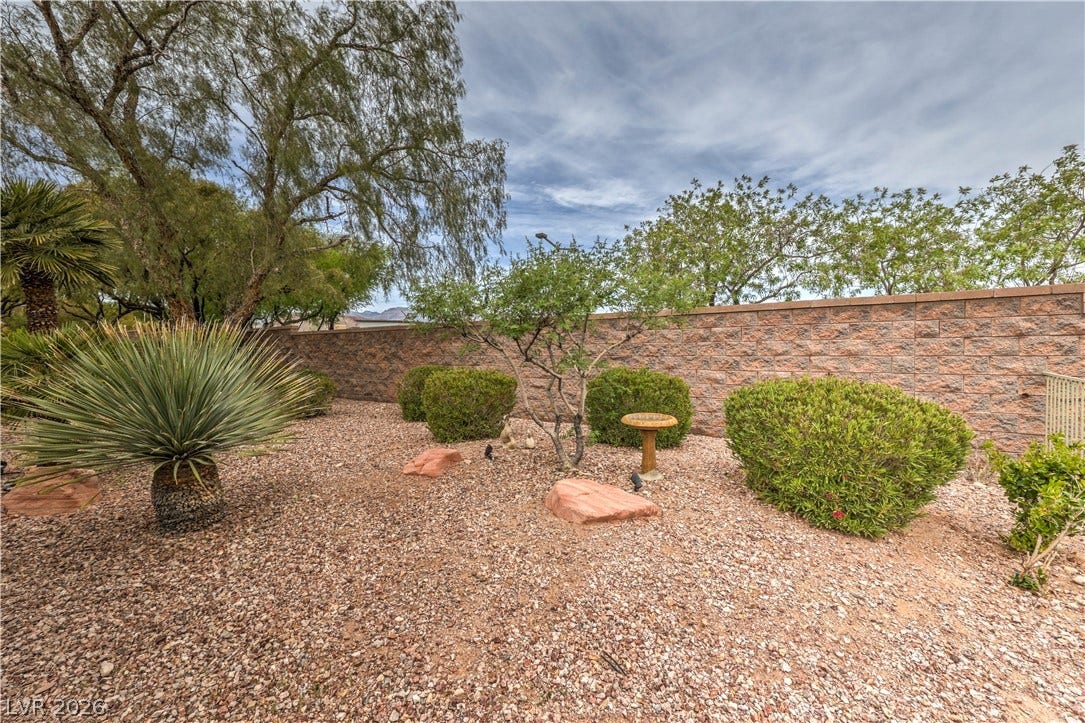 10298 Profeta Court, Las Vegas, NV 89135 A well-maintained xeriscape garden with diverse desert flora provides a serene outdoor escape.