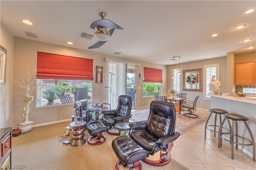 10298 Profeta Court, Las Vegas, NV 89135 Open-concept living space with recessed lighting and a sliding glass door leading to the outdoors.