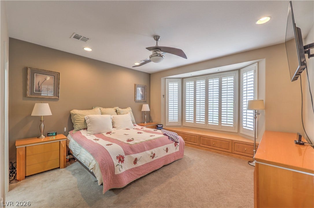 10298 Profeta Court, Las Vegas, NV 89135 A restful chamber offers a cozy window seat with storage, perfect for quiet moments.