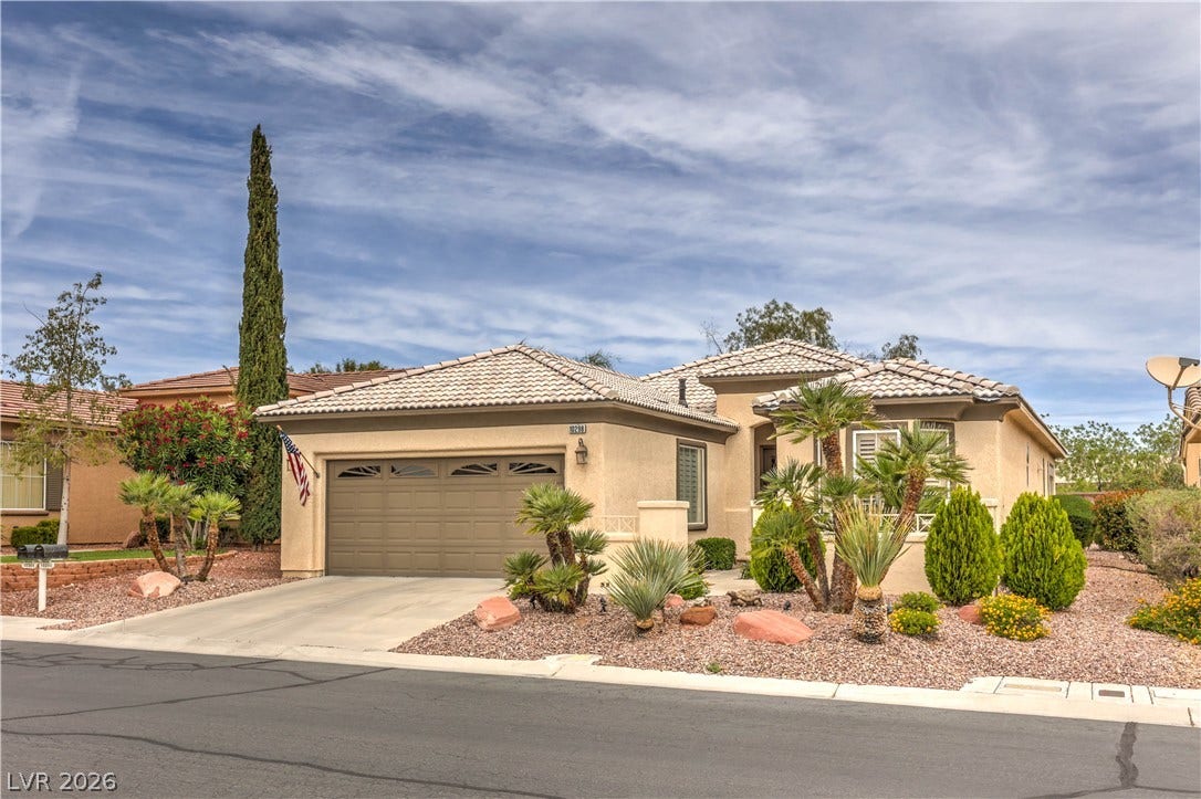10298 Profeta Court, Las Vegas, NV 89135 A well-maintained desert landscape frames this attractive residence with a spacious driveway.