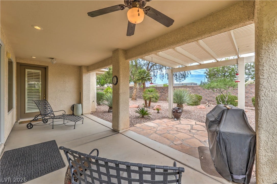 10298 Profeta Court, Las Vegas, NV 89135 An inviting covered patio features a ceiling fan, offering a comfortable outdoor living space.