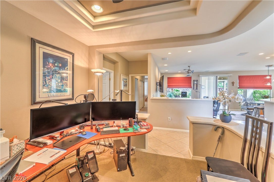 10298 Profeta Court, Las Vegas, NV 89135 Recessed lighting illuminates this versatile study area, transitioning smoothly into a bright, open living space.