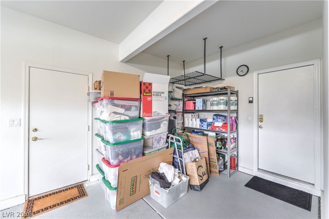 10298 Profeta Court, Las Vegas, NV 89135 Functional garage space with convenient storage solutions and direct interior access.