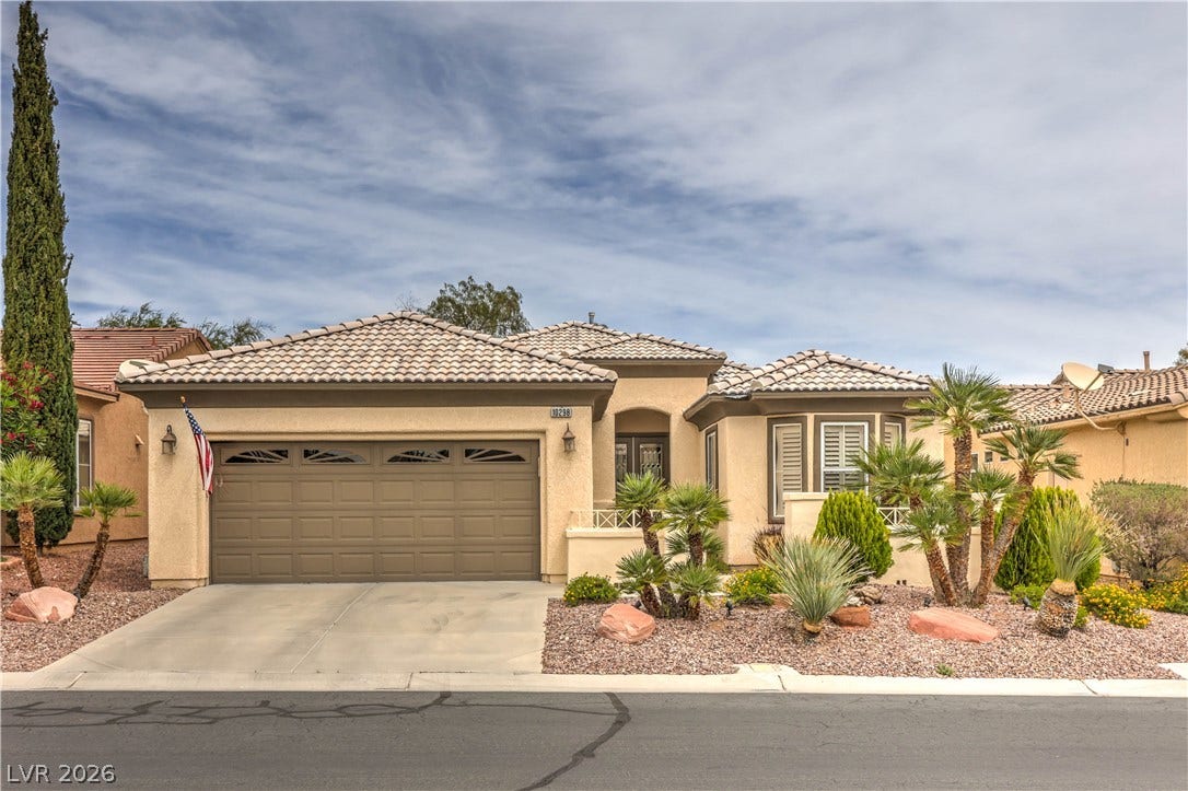 10298 Profeta Court, Las Vegas, NV 89135 A well-maintained stucco home with a tile roof and desert-friendly landscaping invites curb appeal.