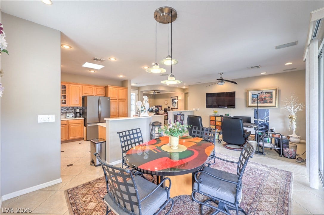 10298 Profeta Court, Las Vegas, NV 89135 An open-concept living area features a bright kitchen, casual dining space, and comfortable lounge perfect for everyday living.