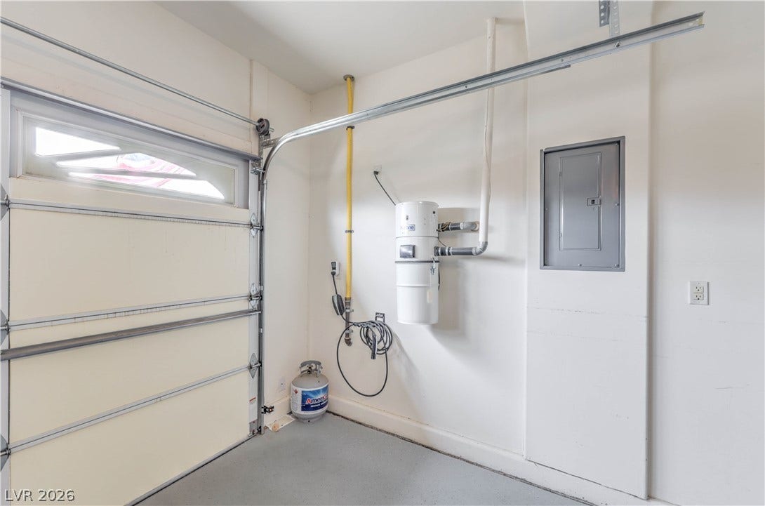 10298 Profeta Court, Las Vegas, NV 89135 A well-maintained garage features a functional garage door and efficient central vacuum system.