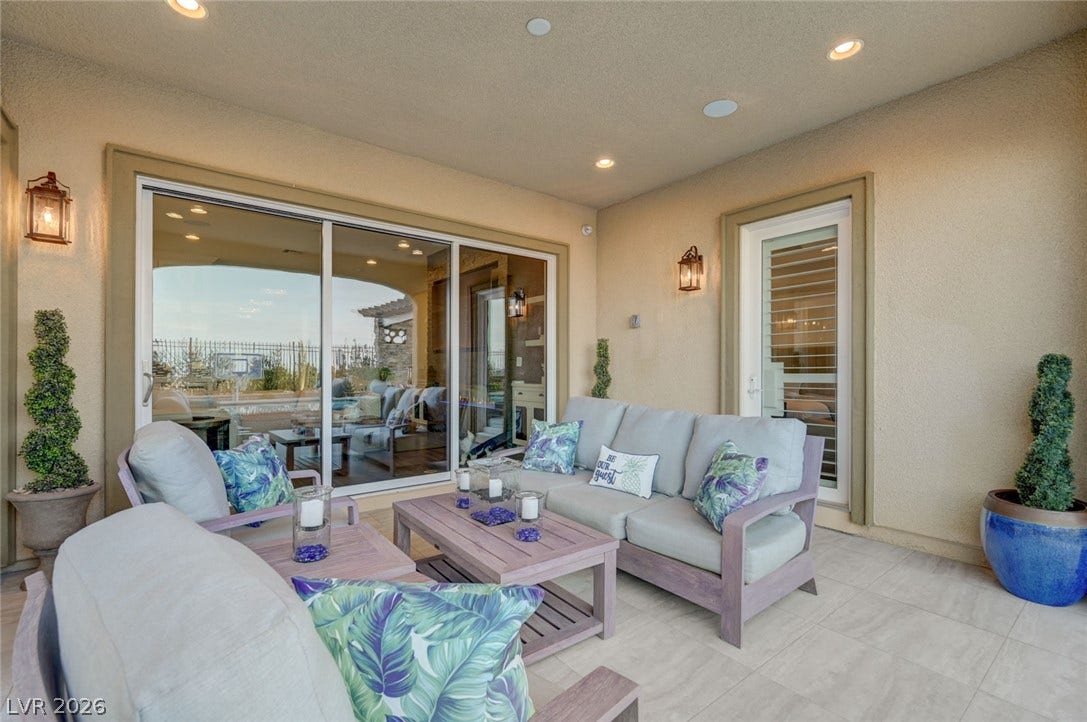 274 Evante Street, Las Vegas, NV 89138 An inviting covered patio with recessed lighting and comfortable seating provides an ideal outdoor living space.
