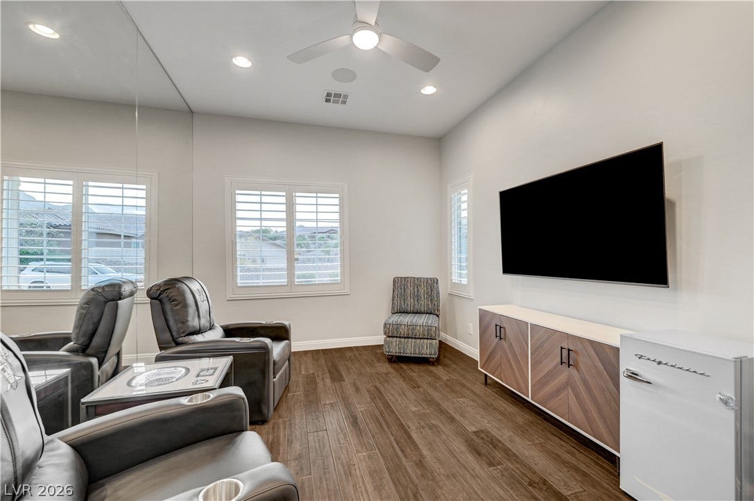 274 Evante Street, Las Vegas, NV 89138 Entertain with ease in this versatile space, featuring rich wood flooring and practical built-in amenities for comfortable viewing.