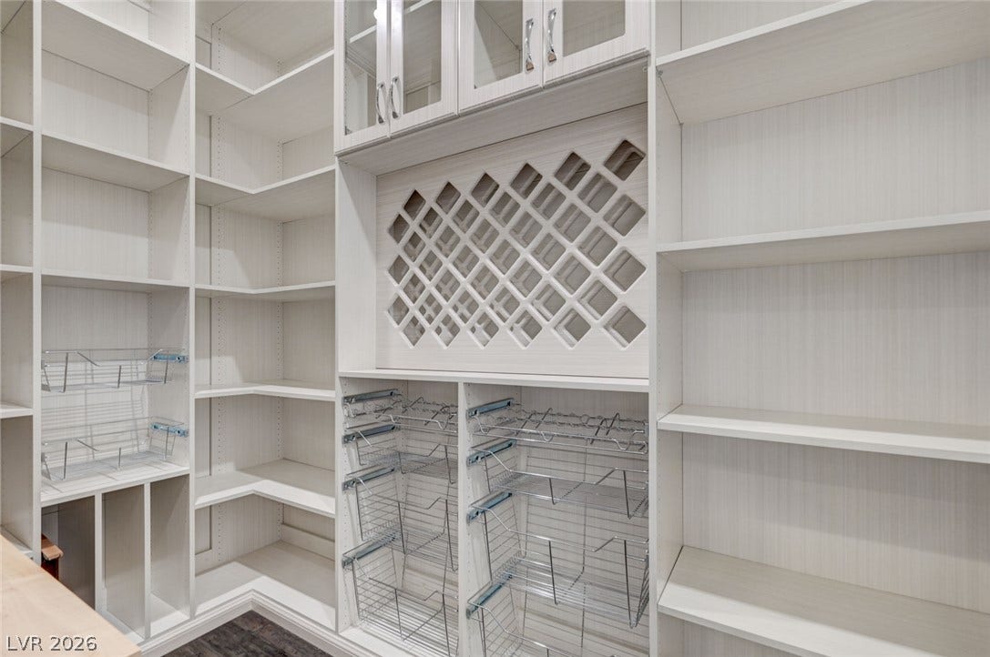 274 Evante Street, Las Vegas, NV 89138 Organized pantry shelving includes pull-out wire baskets and a wine rack.