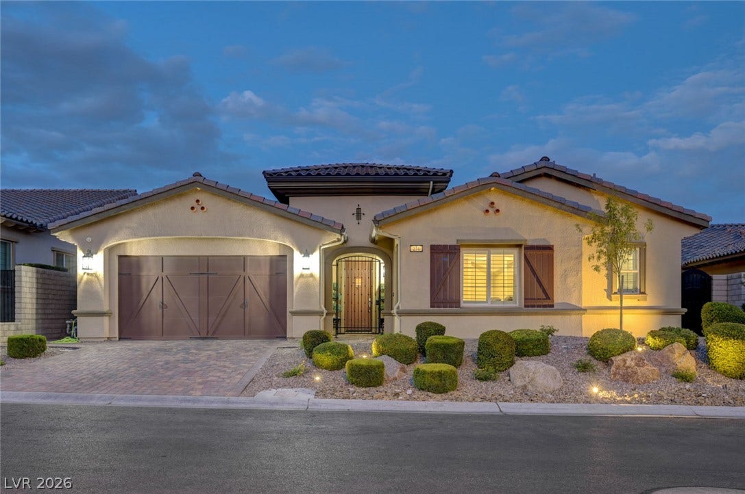 274 Evante Street, Las Vegas, NV 89138 A welcoming facade presents a private front entry courtyard, paver driveway, and well-maintained desert landscaping.