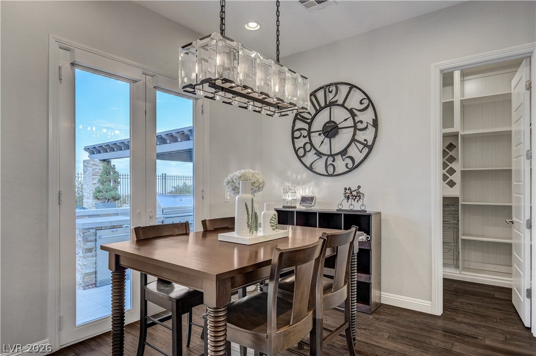 274 Evante Street, Las Vegas, NV 89138 A well-appointed dining space opens to an outdoor grilling area, perfect for seamless entertaining.