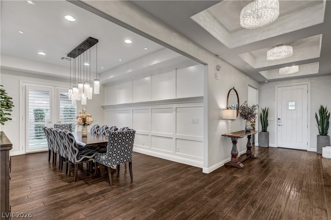 274 Evante Street, Las Vegas, NV 89138 A refined dining space with wood flooring seamlessly connects to the entrance, offering a sophisticated welcome.