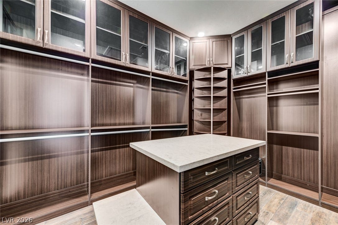 274 Evante Street, Las Vegas, NV 89138 Ample storage solutions and a central island with drawers define this meticulously organized closet space.