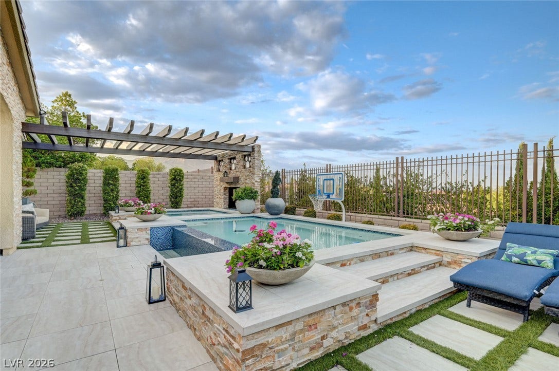 274 Evante Street, Las Vegas, NV 89138 An inviting backyard oasis offers a sparkling pool and spa, alongside an elegant pergola.