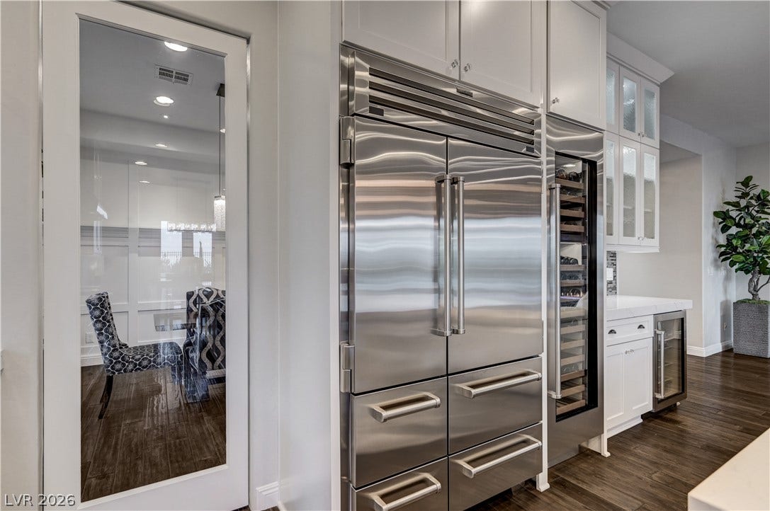274 Evante Street, Las Vegas, NV 89138 A gourmet kitchen boasts premium stainless steel appliances and rich wood flooring, ideal for entertaining.