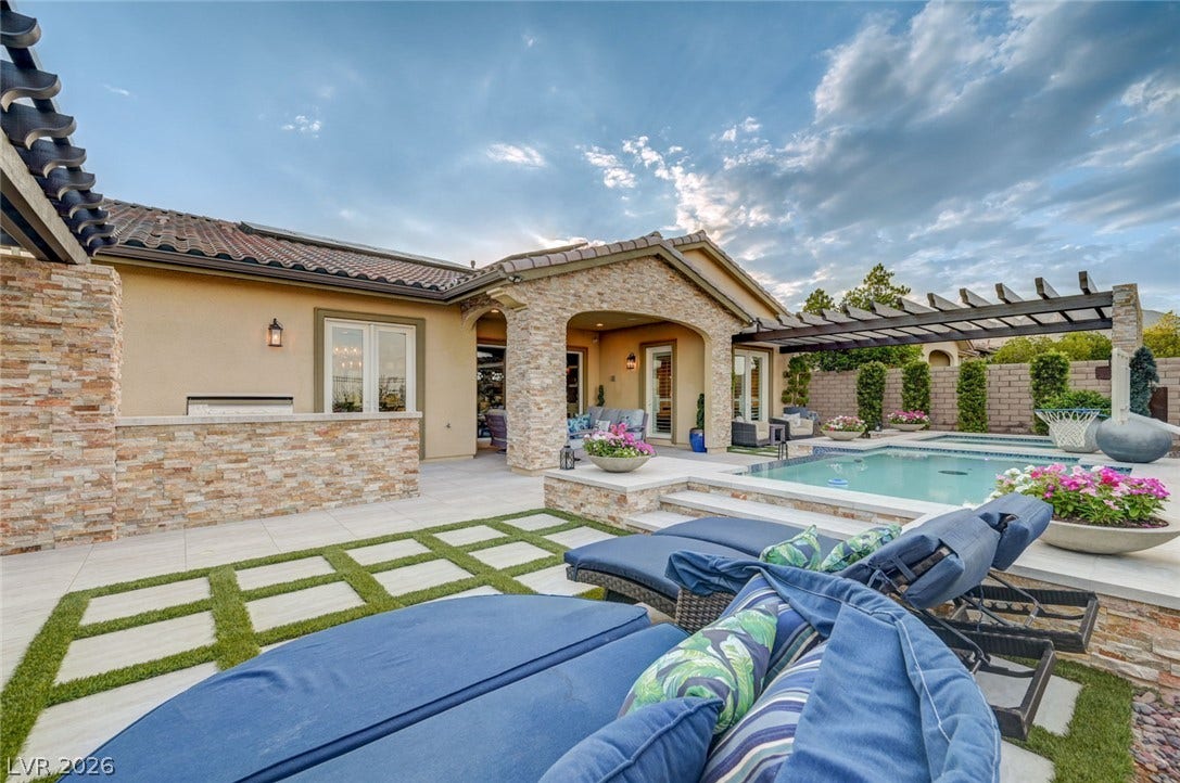 274 Evante Street, Las Vegas, NV 89138 An inviting backyard oasis offers a sparkling pool and a charming outdoor kitchen.