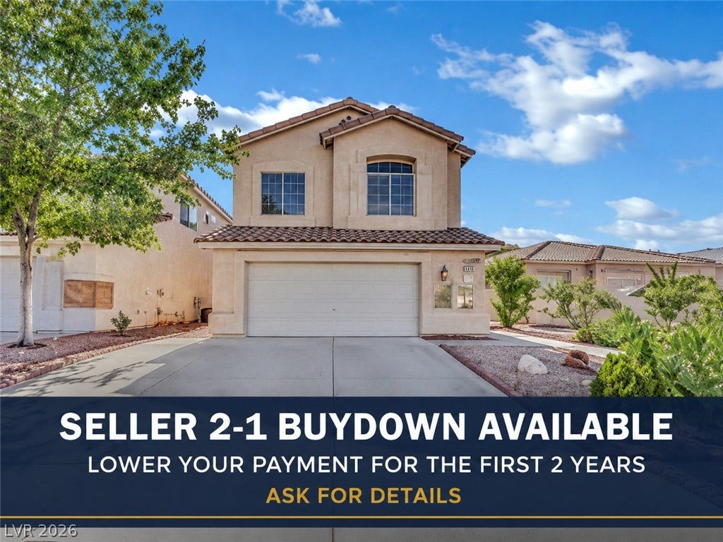 5823 Golden Wing Street, Las Vegas, NV 89113 An inviting two-story exterior showcases classic stucco architecture and a concrete driveway.