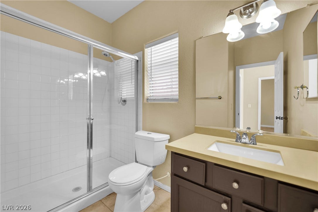 5823 Golden Wing Street, Las Vegas, NV 89113 Functional bathroom featuring a convenient shower stall and a single vanity for everyday ease.