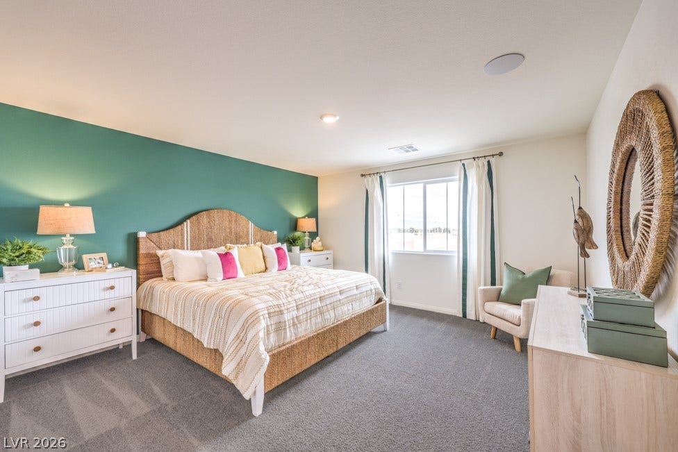 1090 Saffron Toucan Lane, Henderson, NV 89011 Bedroom with dark colored carpet and baseboards. Home is representational only; actual home finishes may vary.
