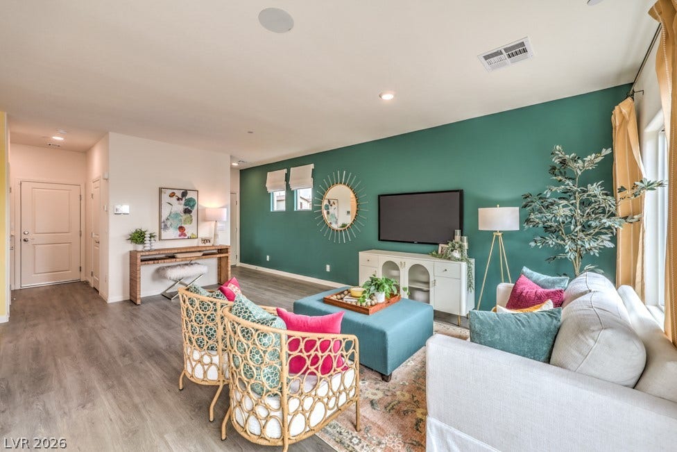 1090 Saffron Toucan Lane, Henderson, NV 89011 Living area featuring wood finished floors and recessed lighting. Home is representational only; actual home finishes may vary.
