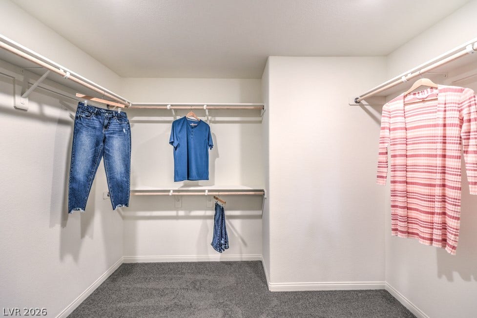 1090 Saffron Toucan Lane, Henderson, NV 89011 Spacious closet with dark carpet. Home is representational only; actual home finishes may vary.