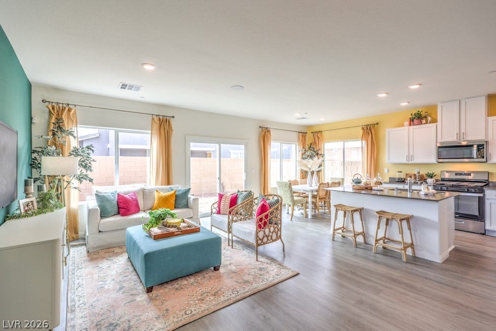 1090 Saffron Toucan Lane, Henderson, NV 89011 Living room featuring light wood-style floors and recessed lighting. Home is representational only; actual home finishes may vary.