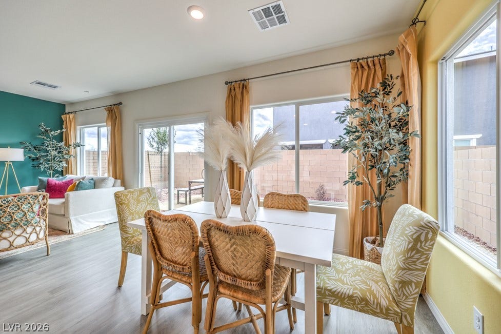 1090 Saffron Toucan Lane, Henderson, NV 89011 Dining space featuring recessed lighting and wood finished floors. Home is representational only; actual home finishes may vary.