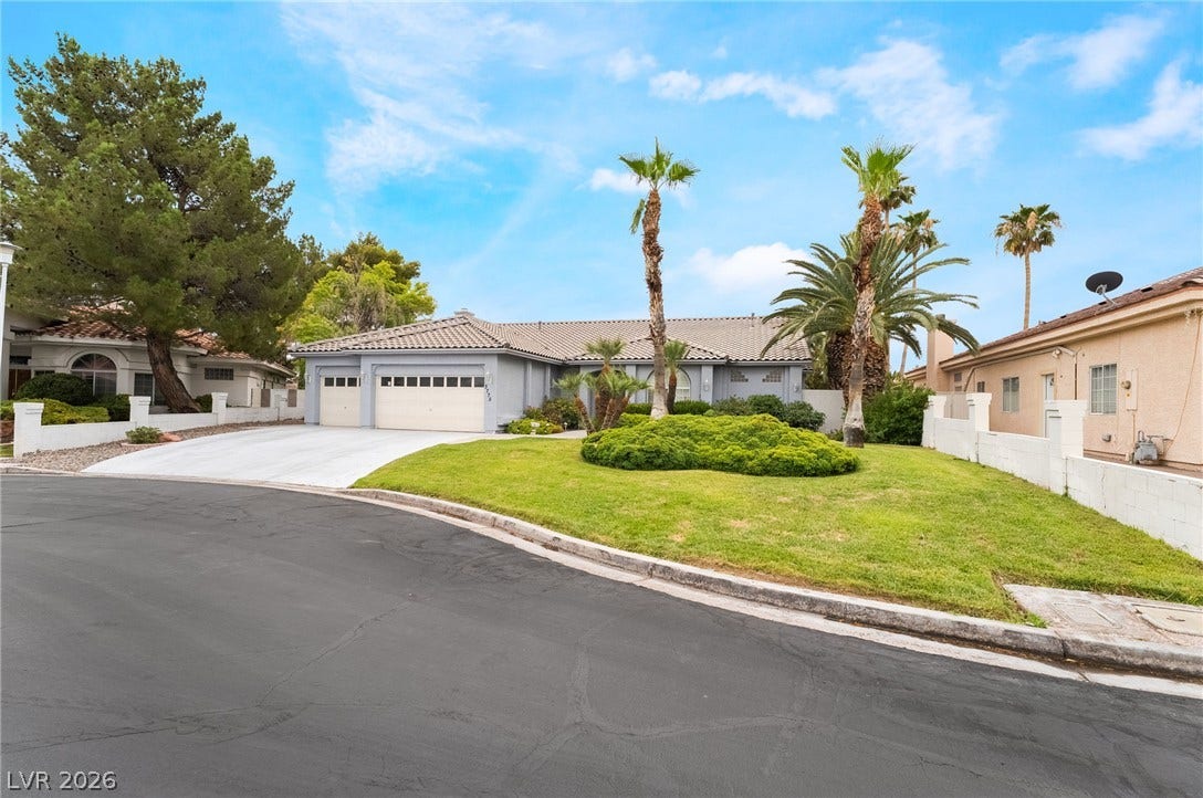 3775 Rick Stratton Drive, Las Vegas, NV 89120 Mature trees and lush landscaping enhance the curb appeal of this inviting single-story residence.