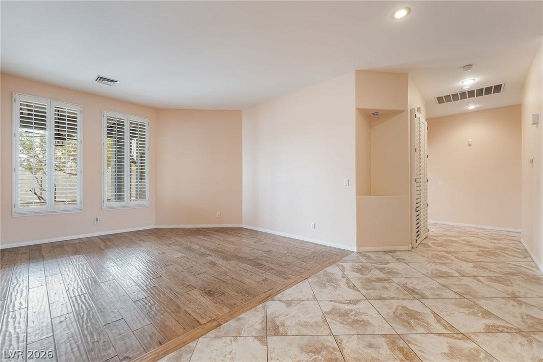 3775 Rick Stratton Drive, Las Vegas, NV 89120 Dual flooring textures define this inviting space, ready for personalized living.