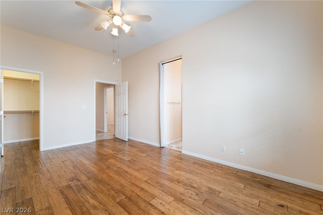 3775 Rick Stratton Drive, Las Vegas, NV 89120 Rich wood flooring grounds this naturally illuminated room, complemented by a ceiling fan for optimal air circulation.