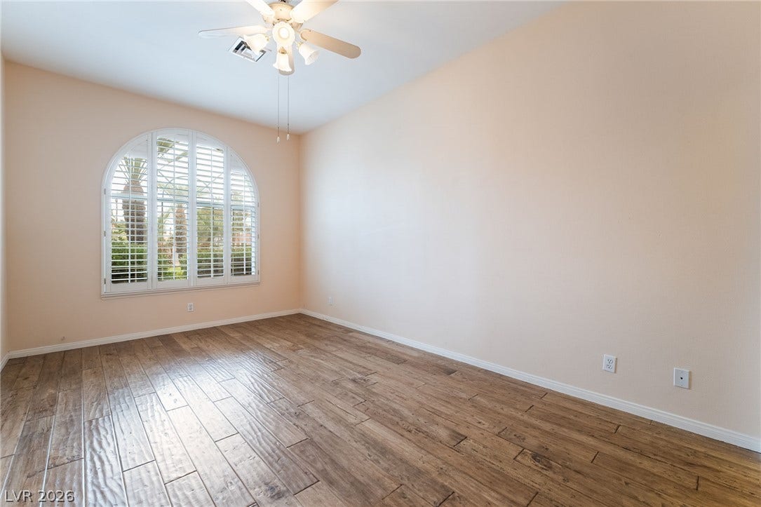 3775 Rick Stratton Drive, Las Vegas, NV 89120 Natural light streams into this room, illuminating the richly textured hardwood flooring.