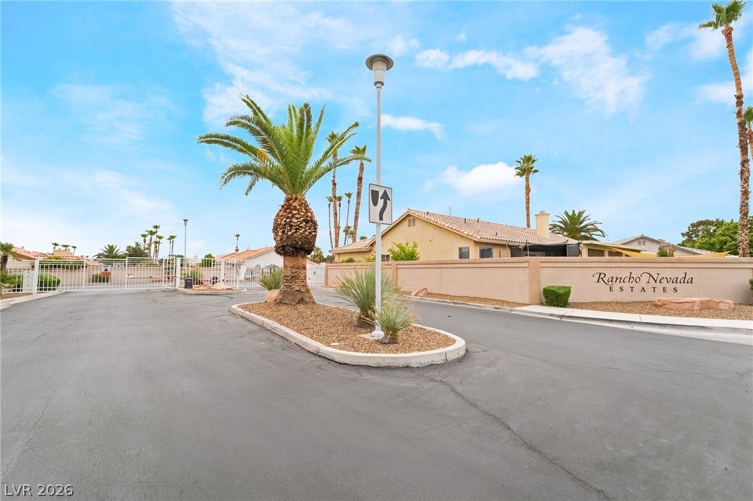 3775 Rick Stratton Drive, Las Vegas, NV 89120 A private, gated entrance welcomes you to the Rancho Nevada Estates community, lined with mature palm trees.