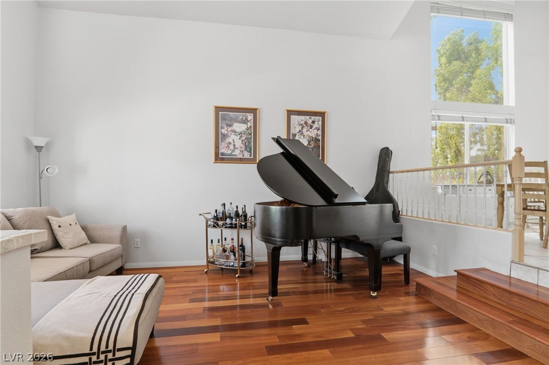 2218 Alanhurst Drive, Henderson, NV 89052 Rich hardwood floors complement a grand piano and bright, naturally illuminated spaces.
