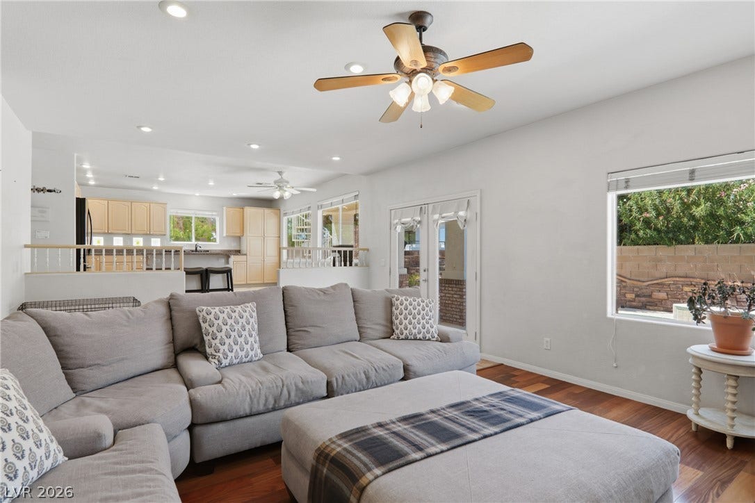 2218 Alanhurst Drive, Henderson, NV 89052 Hardwood floors and French doors enhance this bright and open living area.