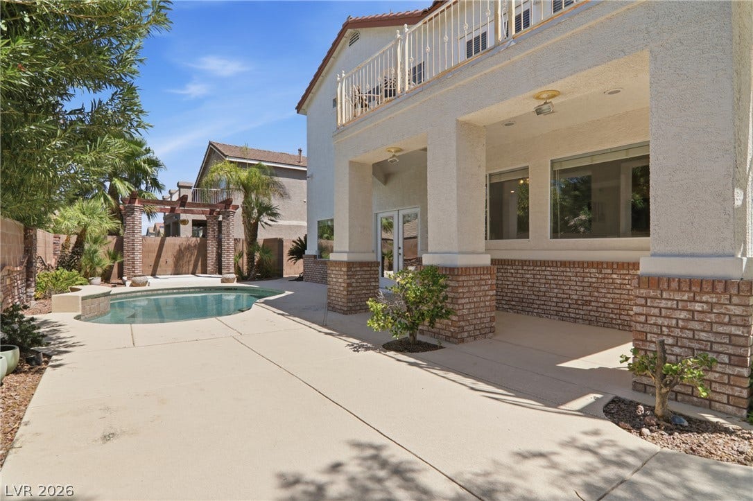 2218 Alanhurst Drive, Henderson, NV 89052 A spacious patio and private pool offer an ideal setting for outdoor entertaining.