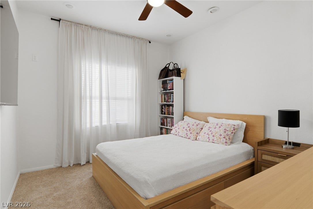 2218 Alanhurst Drive, Henderson, NV 89052 A well-lit bedroom provides ample natural light and a comfortable ambiance.
